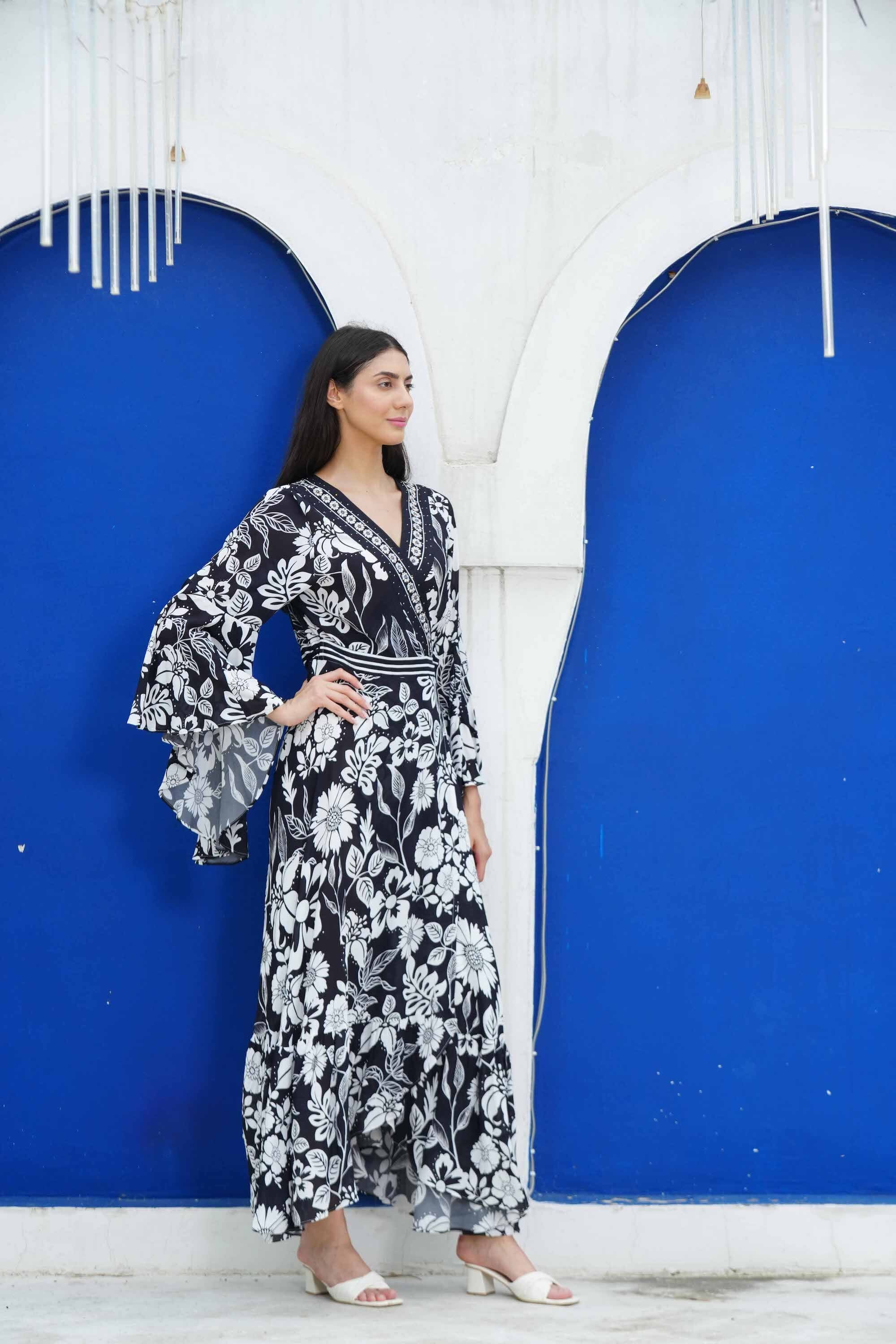 Side view of the black and white AVANTI - DAISY DRESS Modern design with Viscose fabric