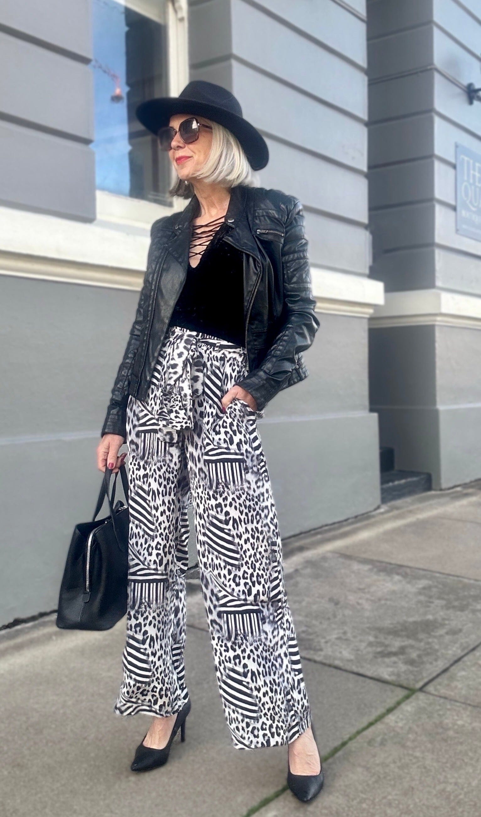 Front view of the Black, White & Orange Zaffari Pants (TheSwankStore) Soft Viscose fabric