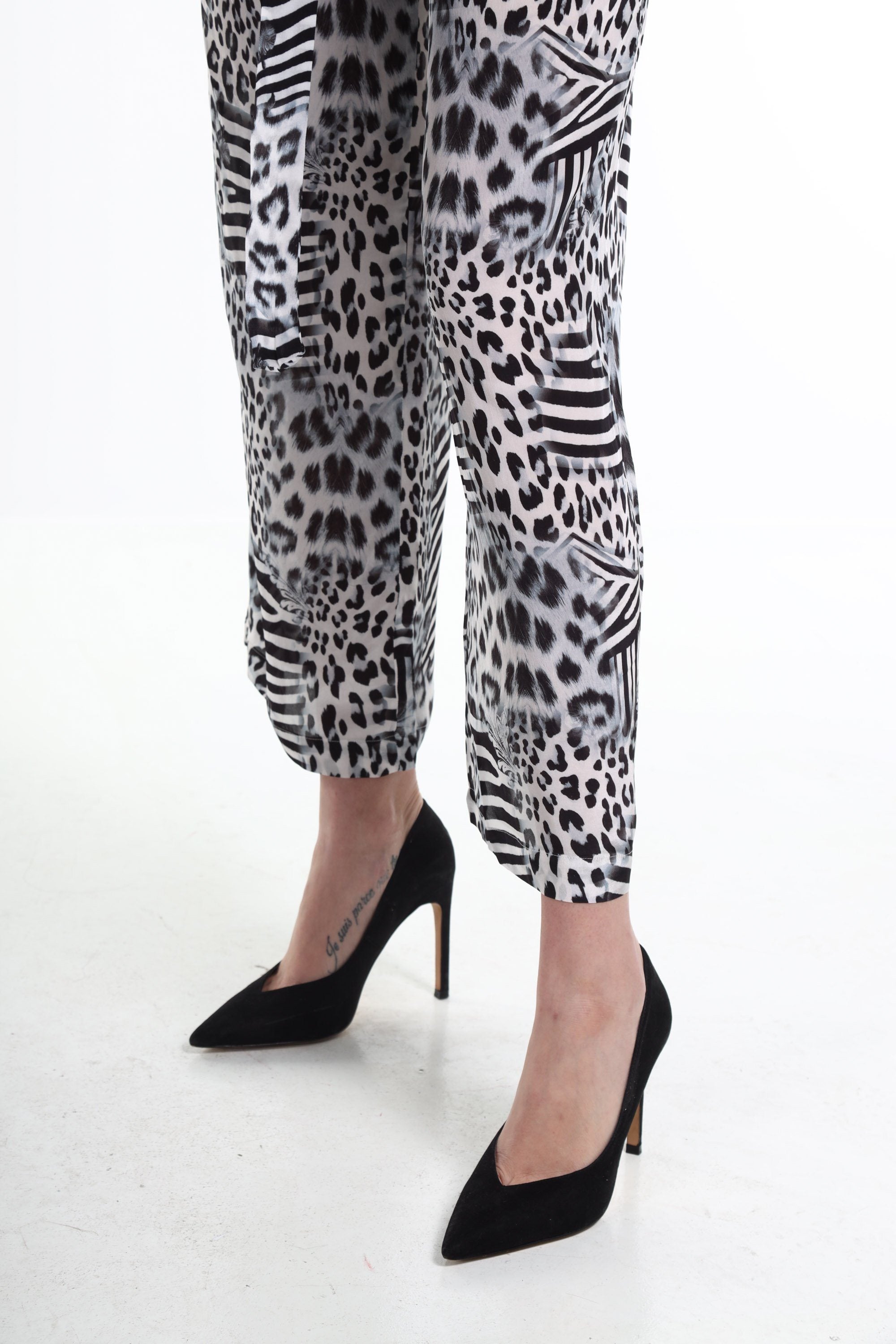 Front view of the Black, White & Orange Zaffari Pants (TheSwankStore) Soft Viscose fabric